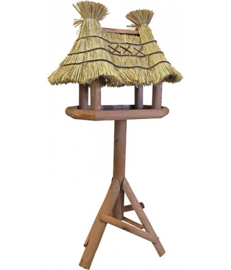 Voederhuis bruin villa de luxe met stro dak.